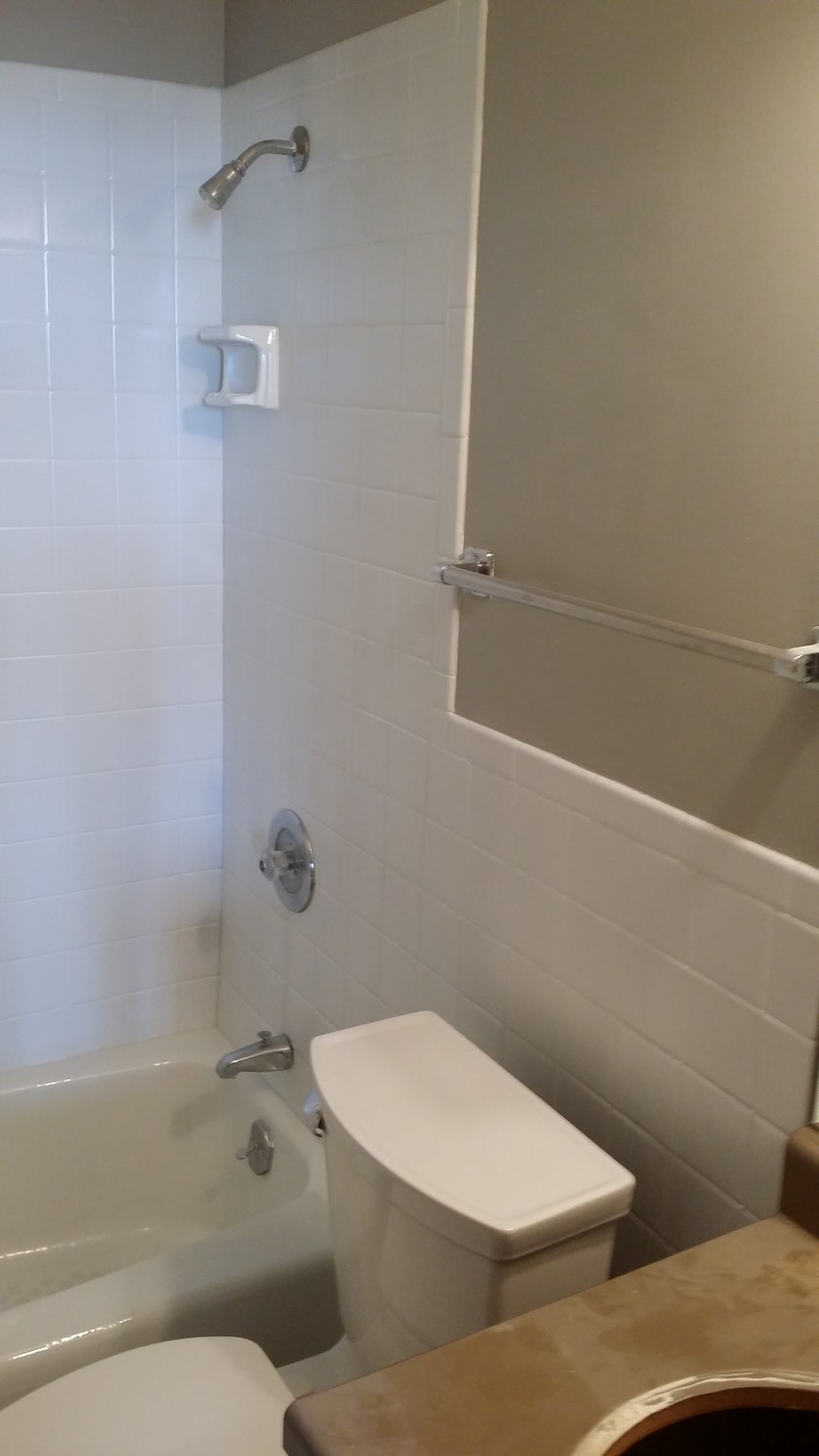 Dirty lack luster tile resurfacing, repair, and refinishing to a brand new clean look.